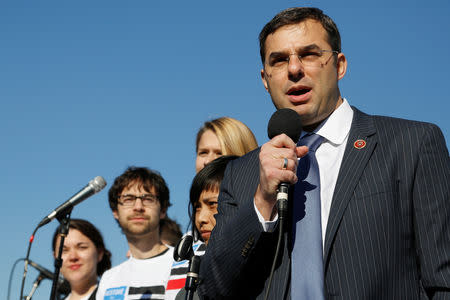 FILE PHOTO: U.S. Representative Justin Amash (R-MI) addresses the "Stop Watching Us: A Rally Against Mass Surveillance" near the U.S. Capitol in Washington, October 26, 2013. REUTERS/Jonathan Ernst/File Photo