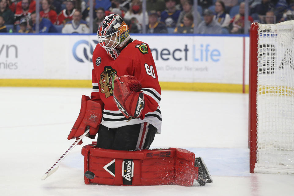 Chicago Blackhawks goaltender Collin Delia blocks a shot during the second period of the team's NHL hockey game against the Buffalo Sabres on Friday, April 29, 2022, in Buffalo, N.Y. (AP Photo/Joshua Bessex)