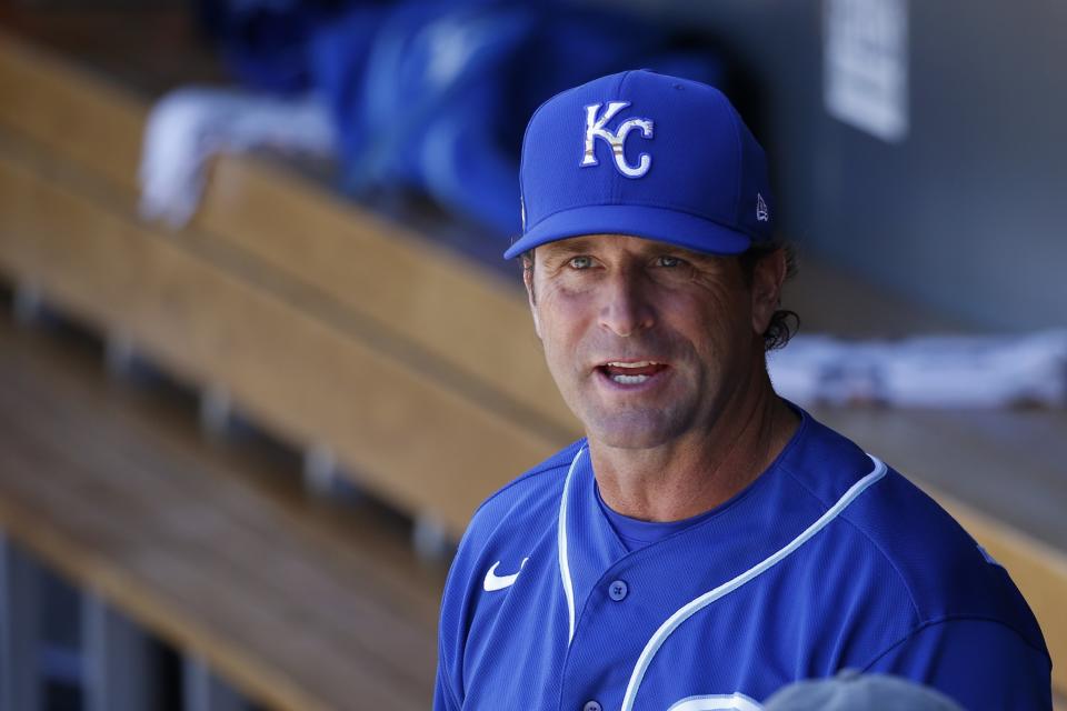 FILE - In this Monday, March 9, 2020, file photo, Kansas City Royals manager Mike Matheny pauses in the dugout prior to a spring training baseball game against the Arizona Diamondbacks in Scottsdale, Ariz. (AP Photo/Ross D. Franklin, File)