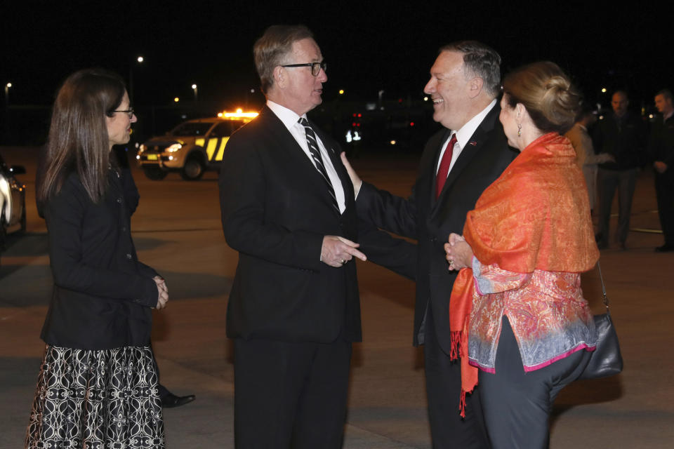 U.S. Secretary of State Mike Pompeo, second from right, and his wife Susan, right, are greeted by U.S. Ambassador to Australia Arthur Culvahouse and U.S. Consul General Sharon Hudson-Dean as they arrive aboard his plane in Sydney Saturday, Aug. 3, 2019. (Jonathan Ernst/Pool Photo via AP)