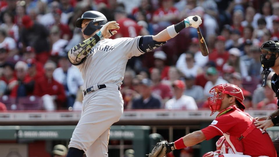 May 20, 2023; Cincinnati, Ohio, USA; New York Yankees center fielder Aaron Judge (99) hits an RBI single against the Cincinnati Reds during the third inning at Great American Ball Park.