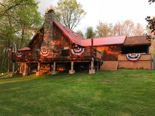 Randy Woloszyn designed and built this log cabin home in Shenango Township.