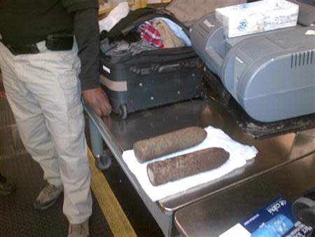 U.S. Transportation Security Administration (TSA) photo shows two military-grade shells in checked baggage at Chicago O'Hare International Airport on April 7, 2014 and released on April 8, 2014. REUTERS/TSA/Handout via Reuters