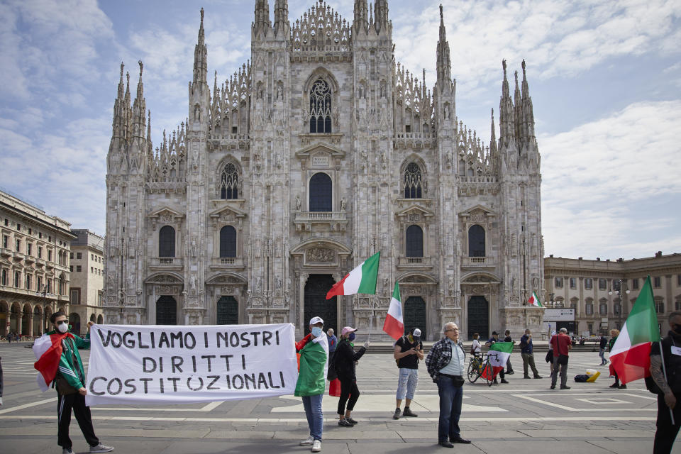 Protesters demonstrate against the government and banks due to the crisis caused by the coronavirus in Piazza del Duomo in Milan, Italy, on Monday.