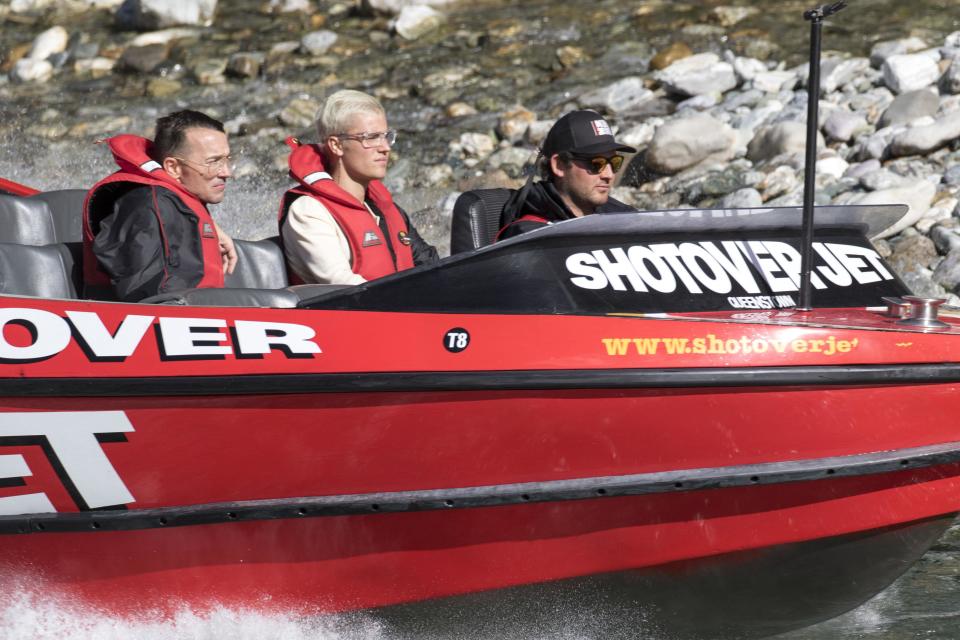 Biebs boards a boat and looks, well bored...