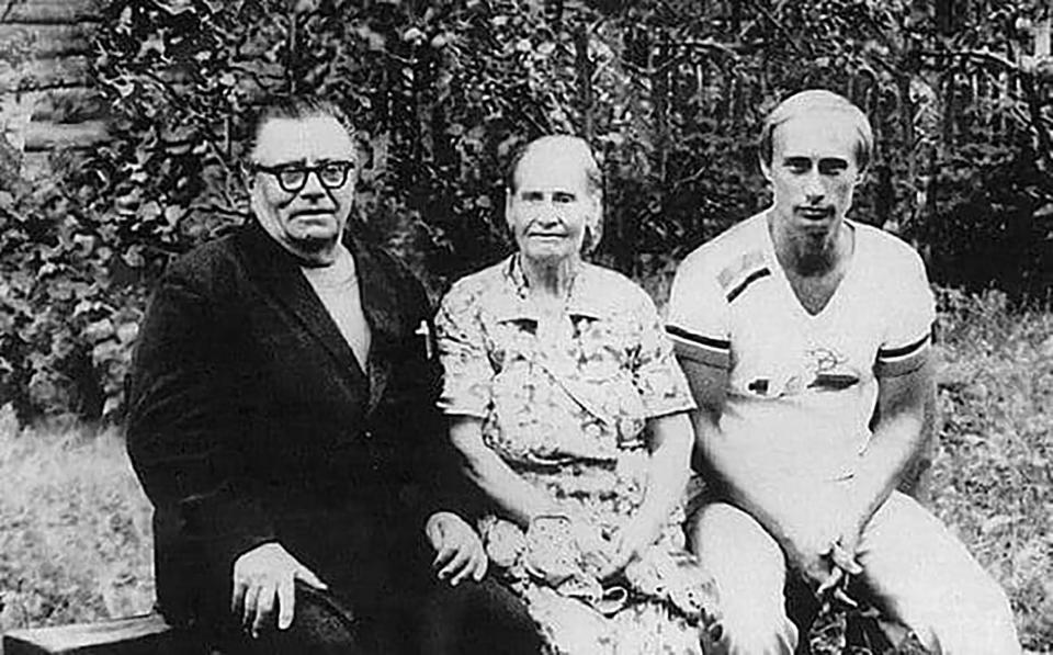 Vladimir Putin (R) pictured with his father Vladimir Putin and mother Maria Putin. Source: East2West/Australscope