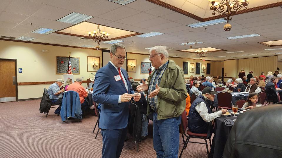 Kevin Sparks, the newly elected state senator for District 31 speaks with a constituent Tuesday at the High Plains Republican Women's monthly meeting in Amarillo.