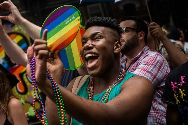 PHOTO: Revelers watch the New York Gay Pride Parade, June 30, 2013, in New York. (Andrew Burton/Getty Images)