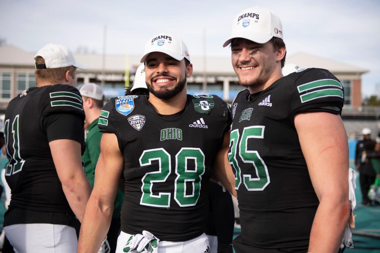 John Glenn grad Shane Bonner, left, and Sheridan grad Shay Taylor, former stars in the Muskingum Valley League, pose for a photo following Ohio's 41-21 win against Georgia Southern in the 2023 Myrtle Beach Bowl in Myrtle Beach, South Carolina. Both players started on defense in the game.