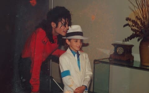 A young Wade Robson with Michael Jackson, who he met at the age of five