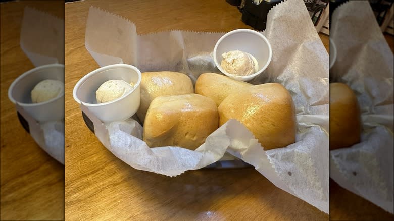 A basket of buns and butter 