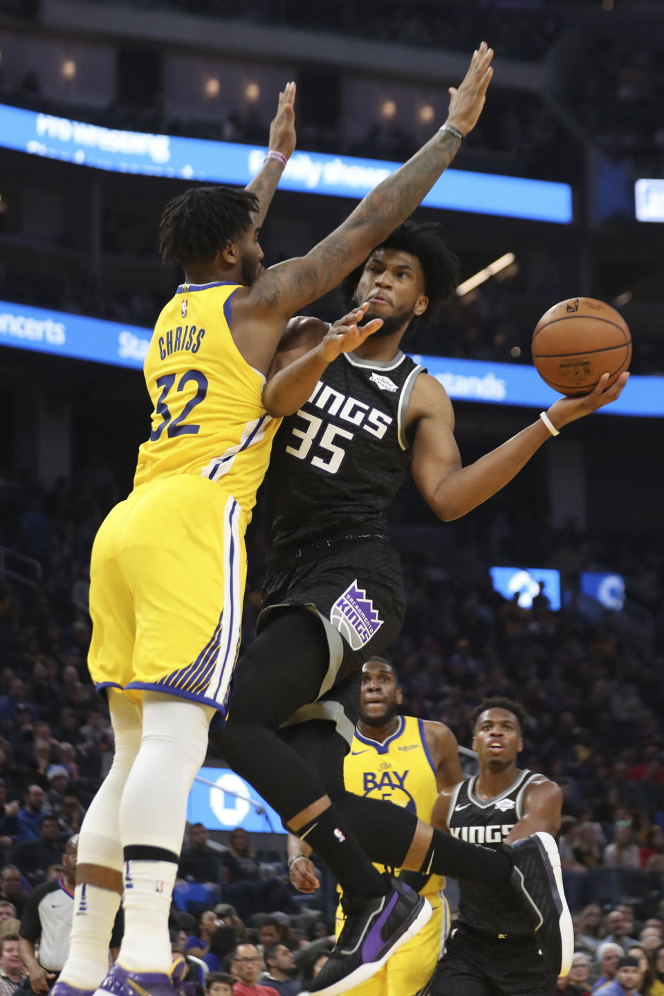 Sacramento Kings forward Marvin Bagley III (35) shoots against Golden State Warriors forward Marquese Chriss (32) during the first half of an NBA basketball game in San Francisco, Sunday, Dec. 15, 2019. (AP Photo/Jed Jacobsohn)