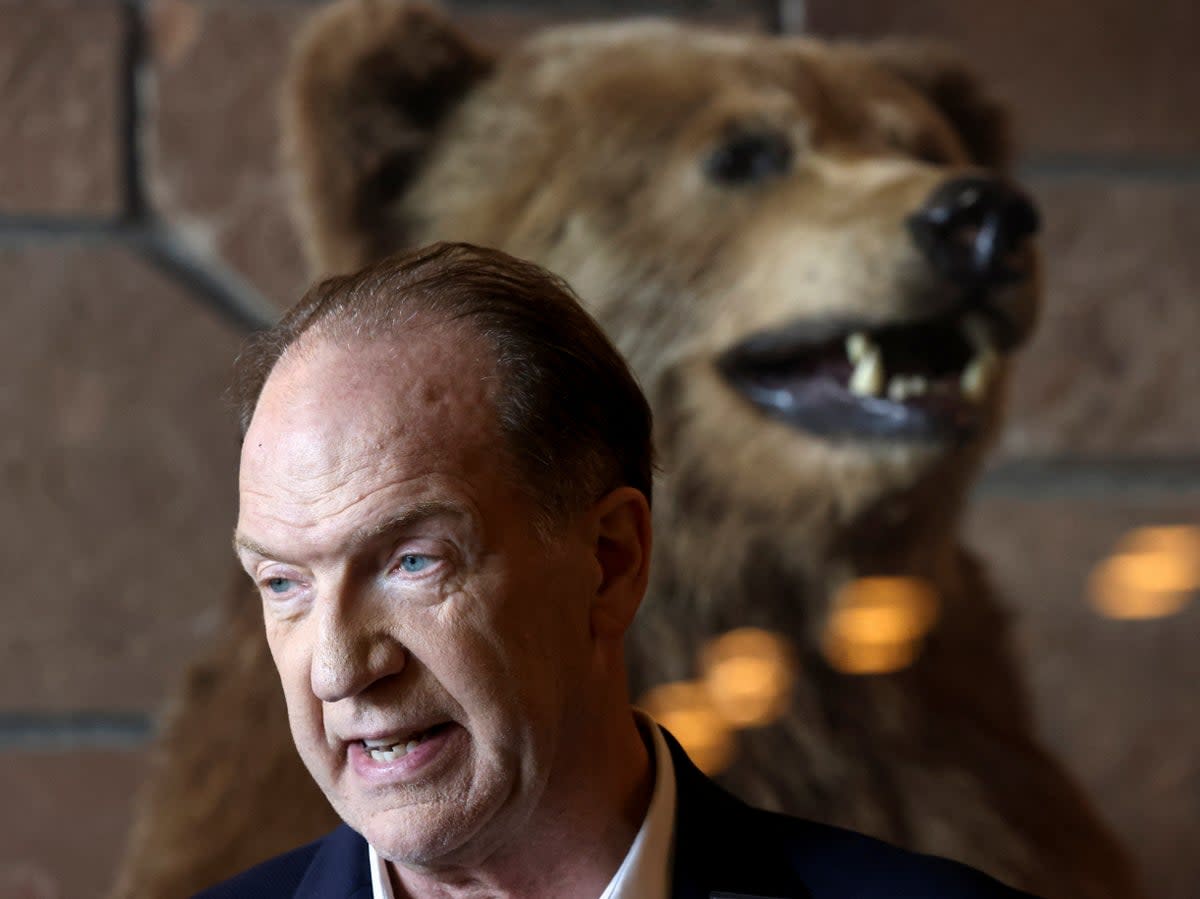 It’s behind you! David Malpass, president of the World Bank Group in front of a stuffed grizzly bear at the Jackson Hole Economic Symposium, in Wyoming on August 26, 2022 (REUTERS)