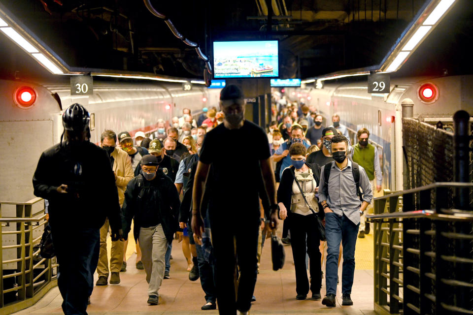 Commuters disembark from a Metro-North train, in New York City (Alexi Rosenfeld / Getty Images file )