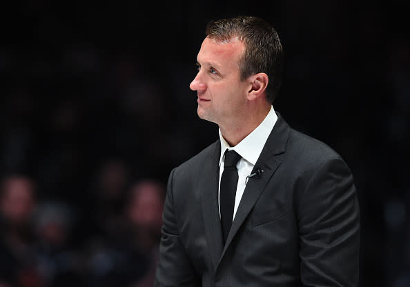 17 January 2015: Former Kings player Rob Blake listens as former team mate Luc Robitaille (not pictured) speaks about his memories with Blake during the pregame ceremony to retire the #4 jersey of former Kings player Rob Blake prior to a game between the Anaheim Ducks and the Los Angeles Kings at STAPLES Center in Los Angeles, CA.