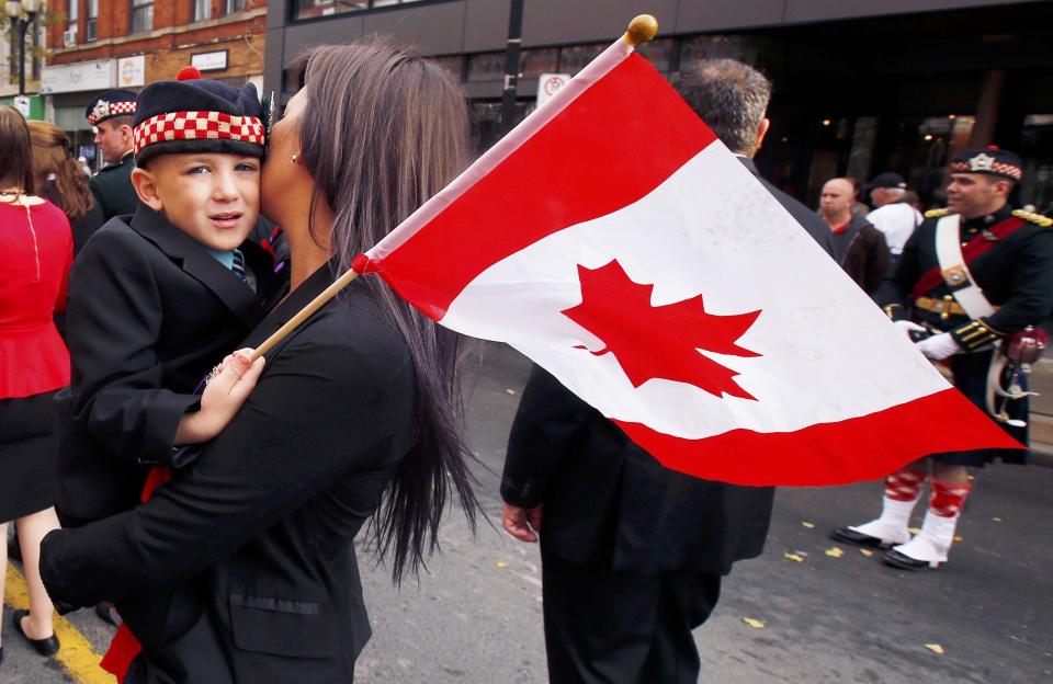 Marcus Cirillo, 5, is carried by his aunt during the funeral procession for his father. (Reuters)