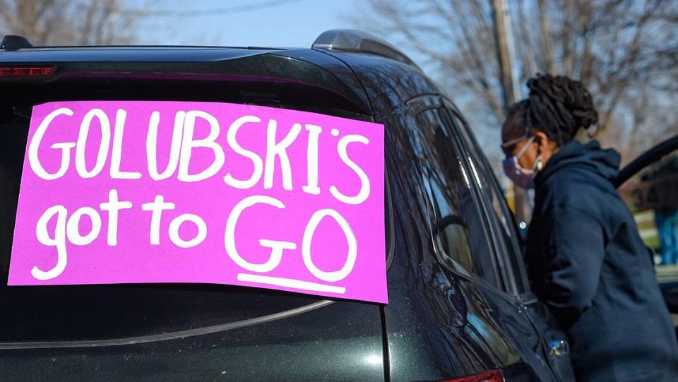 Members and supporters of MORE2, (Metro Organization for Racial and Economic Equity) put signs on cars for a car parade as the group called on public officials and city leaders, including Mayor David Alvey, to seek indictment of Roger Golubski, the retired Kansas City, Kansas police detective who allegedly sexually abused Black women of the community during his career as an officer in Wyandotte County. The group held the car parade Friday, March 19, which took the group past City Hall in Kansas City, Kansas.