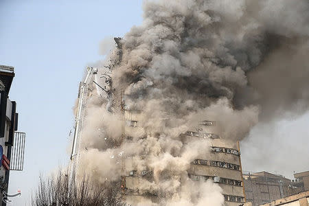 Smoke rises from a blazing high-rise building in Tehran, Iran January 19, 2017. Tasnim News Agency/Handout via REUTERS