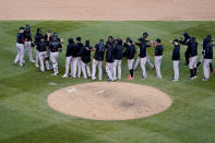 Members of the Miami Marlins celebrate after defeating the Chicago Cubs in Game 2 of a National League wild-card baseball series Friday, Oct. 2, 2020, in Chicago. The Marlins won the series 2-0 to advance to the division series. (AP Photo/Nam Y. Huh)