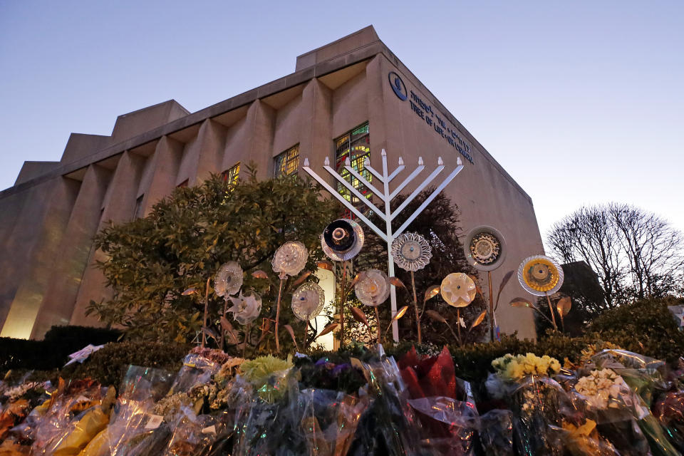 A menorah is installed outside the Tree of Life Synagogue in preparation for a celebration service at sundown on the first night of Hanukkah, Sunday, Dec. 2, 2018 in the Squirrel Hill neighborhood of Pittsburgh. A gunman shot and killed 11 people while they worshipped Saturday, Oct. 27, 2018 at the temple. (AP Photo/Gene J. Puskar)
