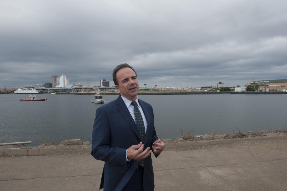 Joe Ganim, mayor of Bridgeport, Connecticut, stands near a harbor as he speaks to members of the media. 