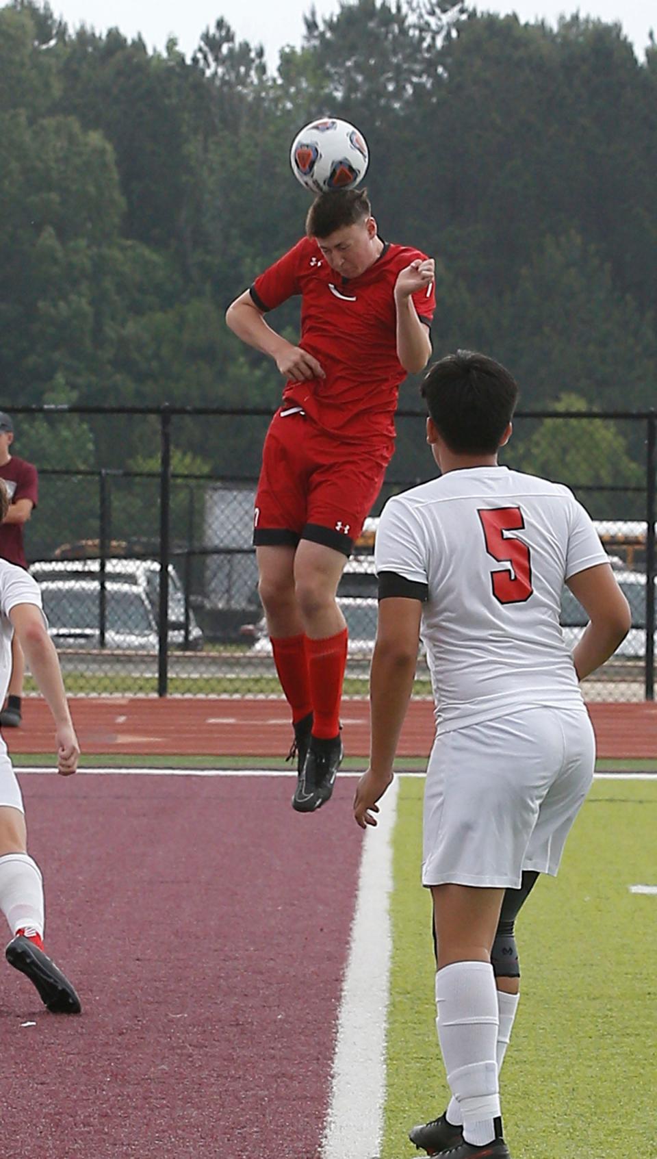 Clarksville senior Cody Qualls (7) heads off the ball during the first half of the Class 4A state championship on May 21, 2022, at Everett Field in Benton.