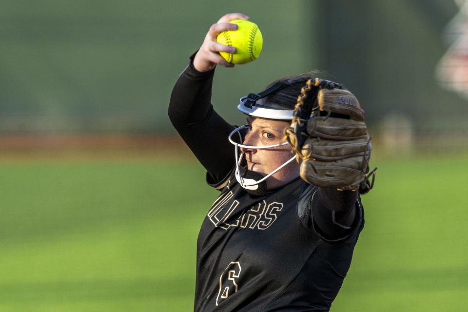 Noblesville High School senior Claire Cullen (6) delivers a pitch during an IHSAA softball game against Lawrence North High School, Friday, April 12, 2024, at Lawrence North High School.