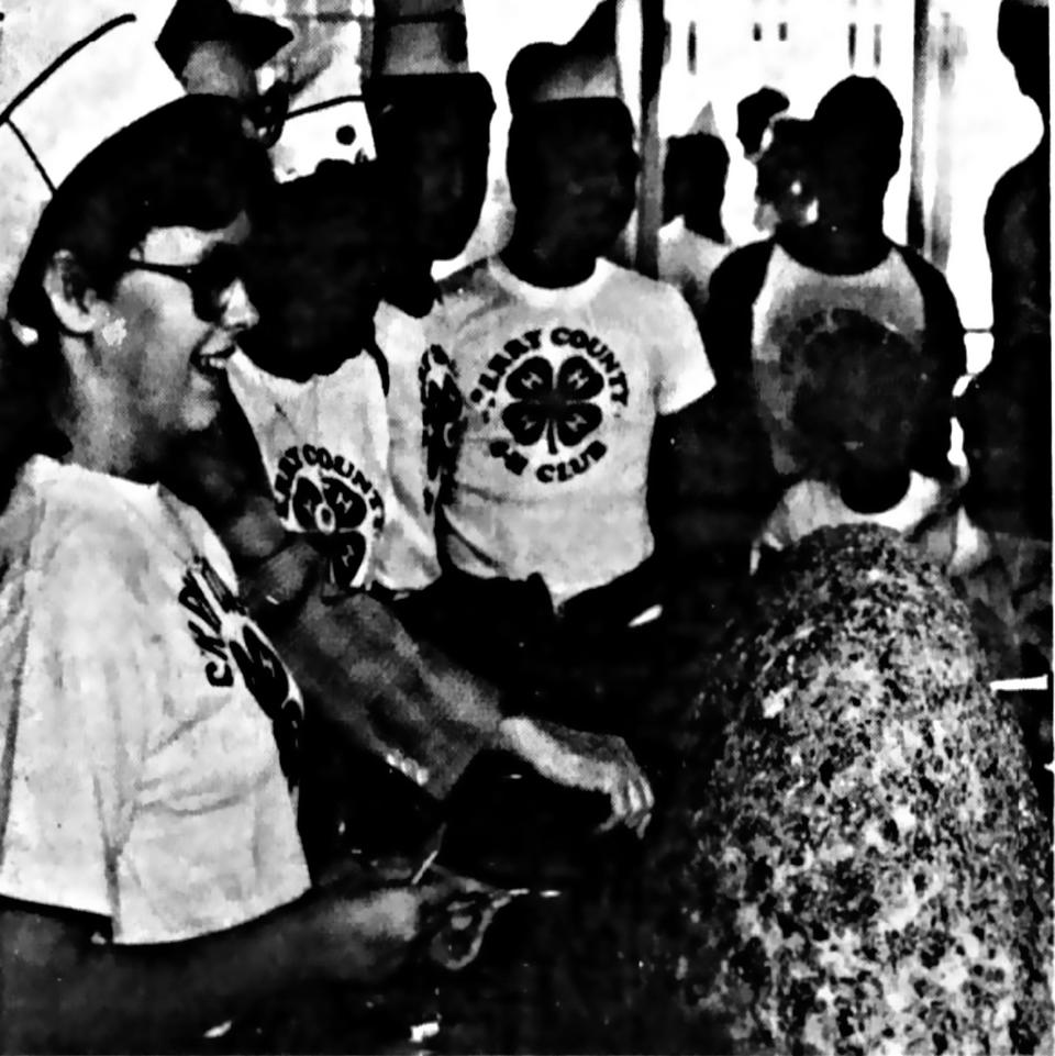 Students from the Perry County 4-H club surround a cheeseball they made that weighed more than 200 pounds in May 1987.