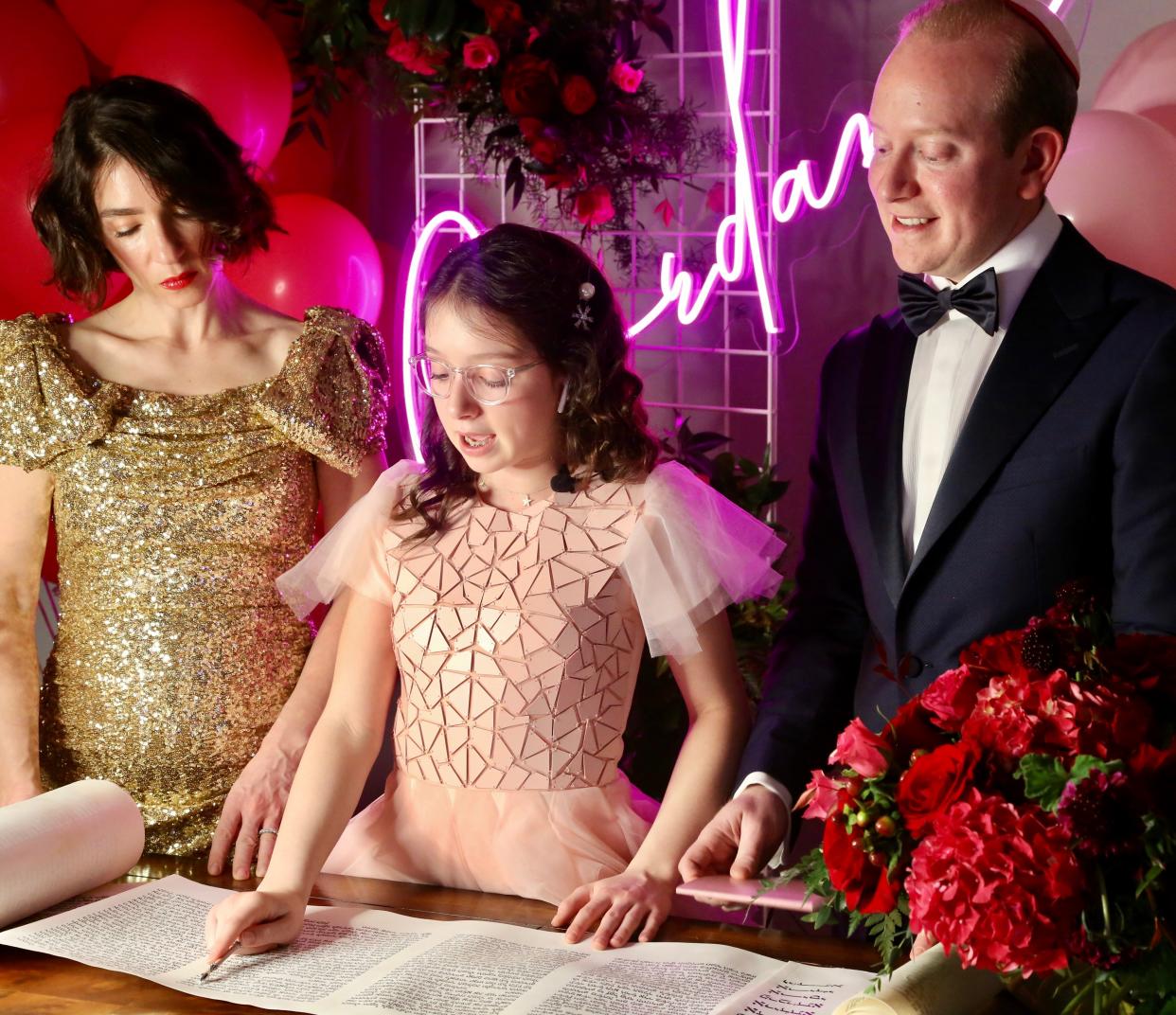 Rebecca, Jordana and Yehuda Shmidman celebrate the 12-year-old's bat mitzvah in their living room during coronavirus quarantine. (Photo courtesy of Yehuda Shmidman)