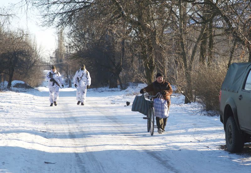 Service members of the Ukrainian armed forces are seen near combat positions in Donetsk region