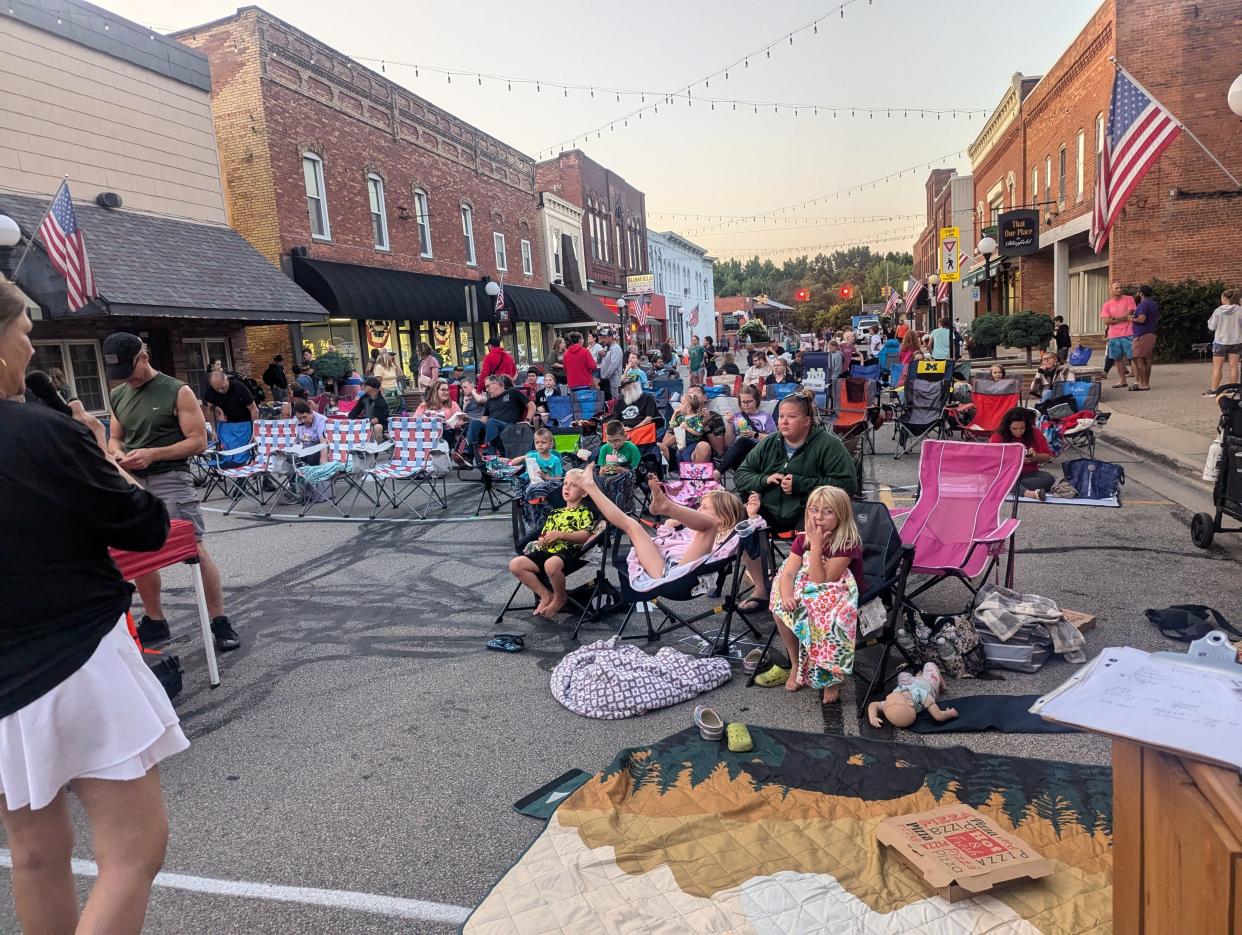 A crowd of people is pictured gathered in downtown Blissfield July 18, 2024, for the village's monthly Movies on Lane programming. "Jurassic Park" was the movie that was shown last month as part of the 2024 summer edition of Movies on Lane.