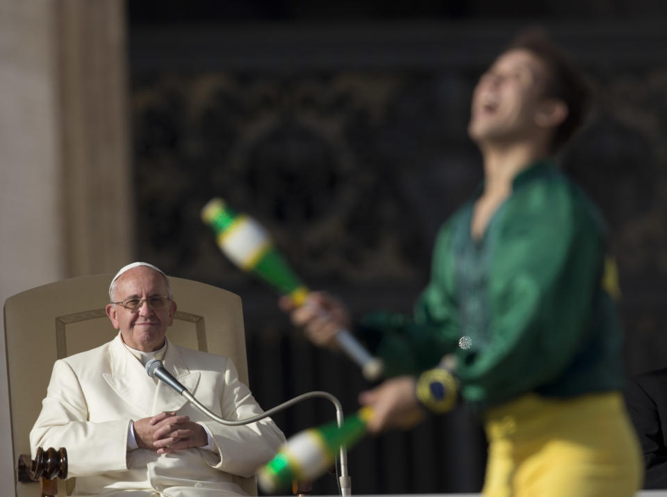 A member of Golden Circus performs in front of Pope Francis during his weekly general audience in St. Peter's Square at the Vatican, Wednesday, Jan. 8, 2014. (AP Photo/Alessandra Tarantino)