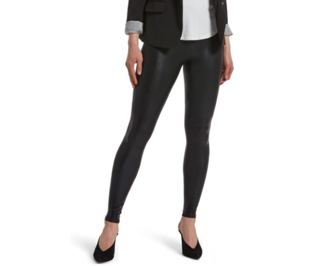 Lower half of model wearing these glossy black leggings with a white tee shirt and black blazer and black heels