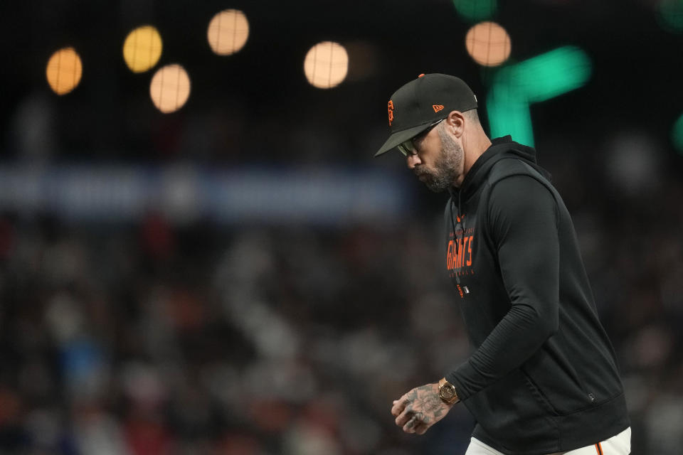 San Francisco Giants manager Gabe Kapler returns to the dugout after making a pitching change during the seventh inning of his team's baseball game against the Tampa Bay Rays in San Francisco, Monday, Aug. 14, 2023. (AP Photo/Jeff Chiu)