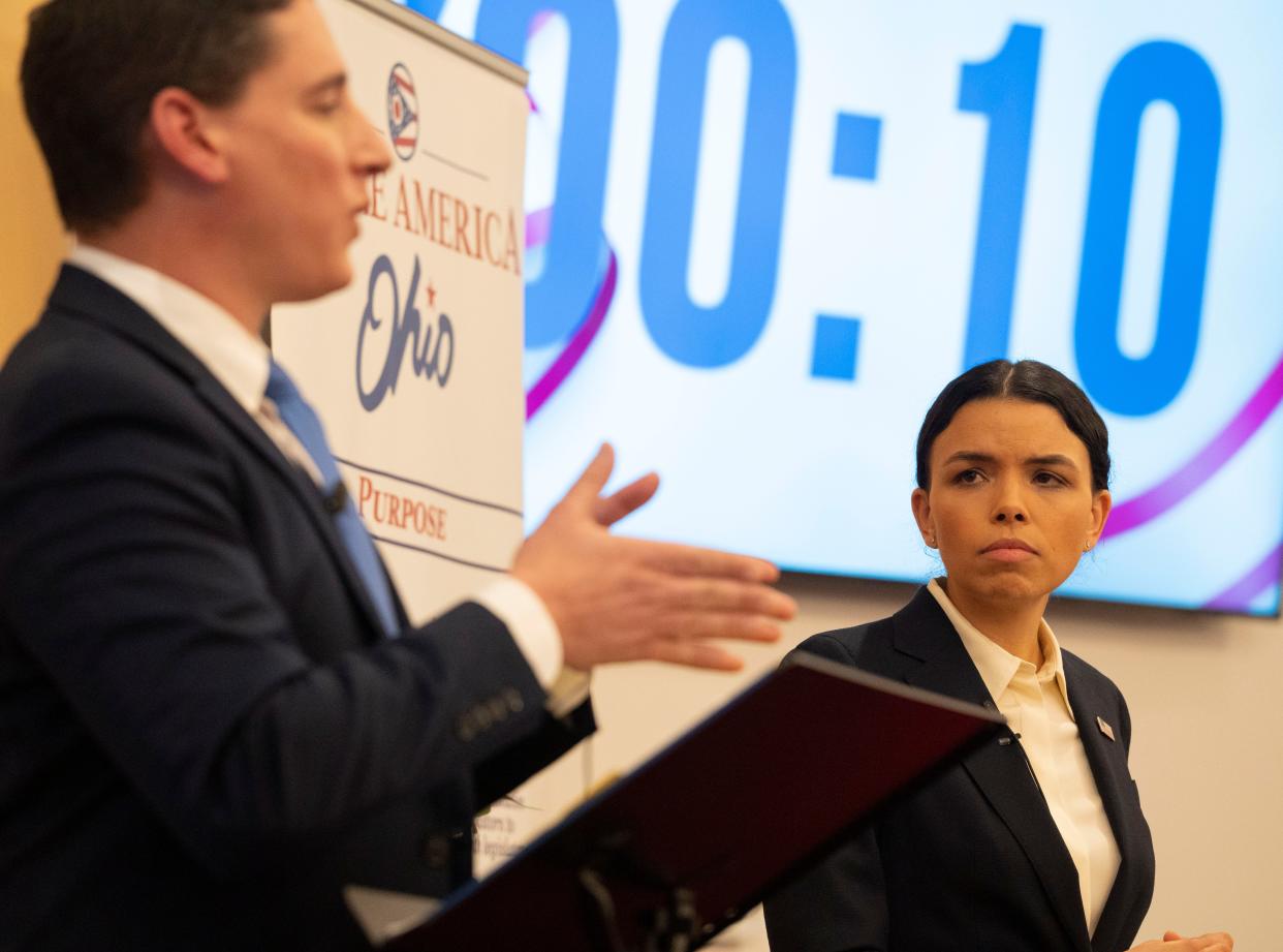 Democratic candidate Morgan Harper looks at Republican candidate Josh Mandel while he speaks during an Ohio Senate debate at North Columbus Baptist Church in Columbus, Ohio, on Thursday, Jan. 27, 2022.  