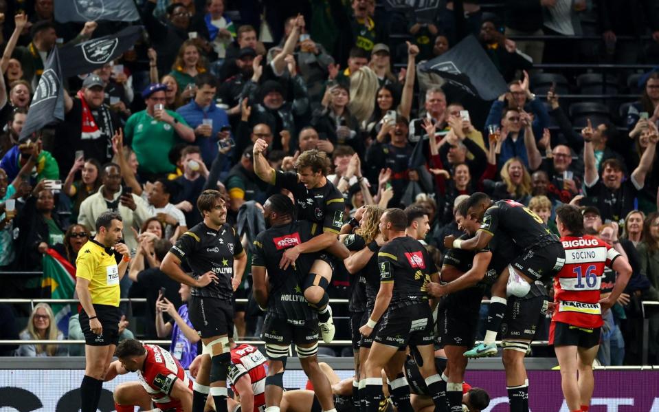 The Sharks players celebrate their victory tonight in the Challenge Cup final