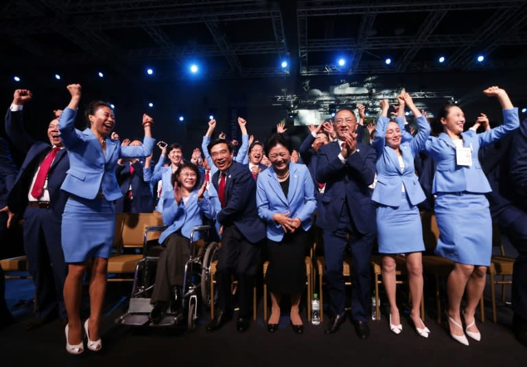 Members of the delegation from Beijing 2022 Winter Olympics candidate city reacts after the city was elected to host the 2022 Olympic Winter Games