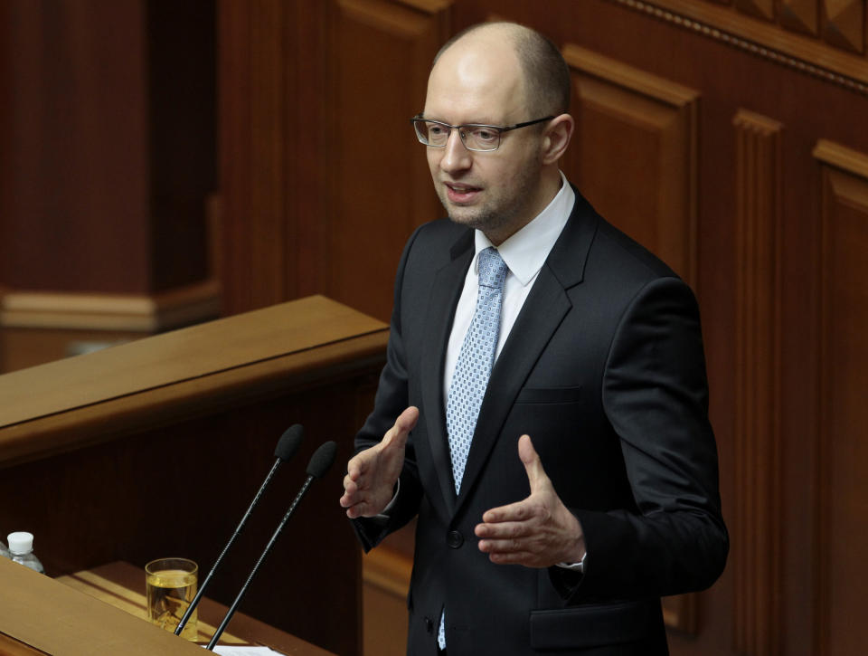 FILE - In this April 29, 2014 file photo, Ukrainian Prime Minister, Arseniy Yatsenyuk, speaks to lawmakers during a session at the Ukrainian parliament in Kiev. Yatsenyuk’s interim government is seeking to carry out sweeping reforms to break from a culture of self-interest, cynicism and corruption that left the country on the verge of bankruptcy. (AP Photo/Sergei Chuzavkov, File)