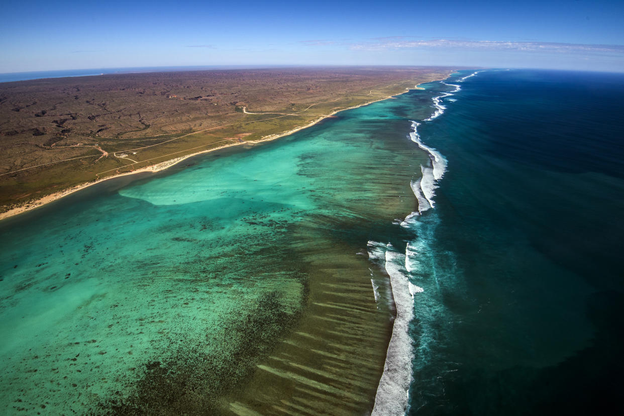 Aerial View of the Ningaloo Reef in Western Australia and the Cape Range National Park where the desert meets the sea from a birds eye view