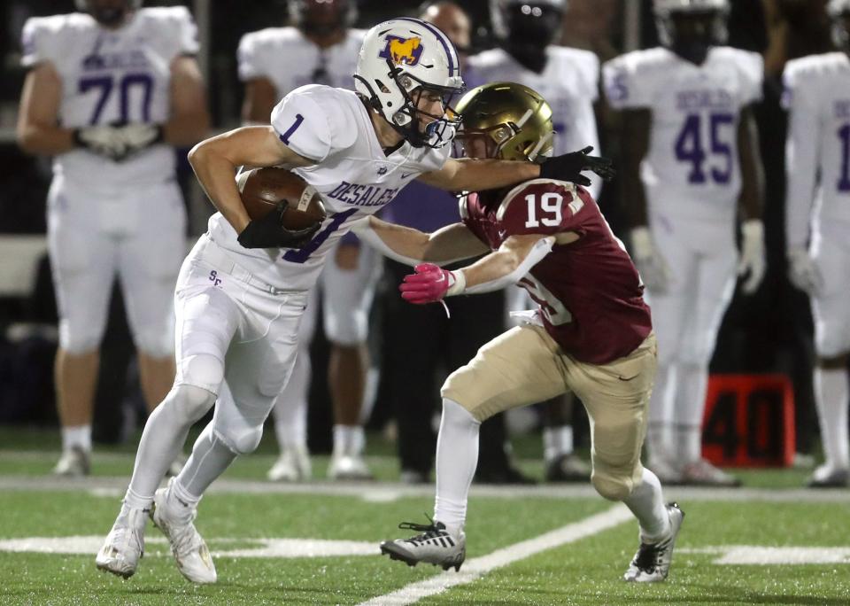 DeSales' Isaac Pekarcik pushes past Watterson's Cal Mangini during a game Oct. 7 at Ohio Dominican University in Columbus.