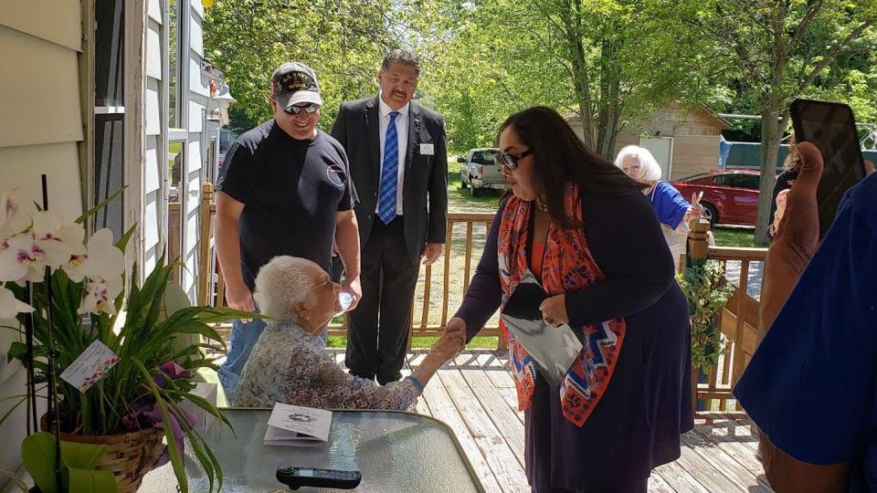 Ambassador Reyna Mendivil Torres (right) greets Nellie Muños (left), a must-see person for visitors to Hero Street. Mendivil Torres received a blessing from Muños. (Brian Muños)