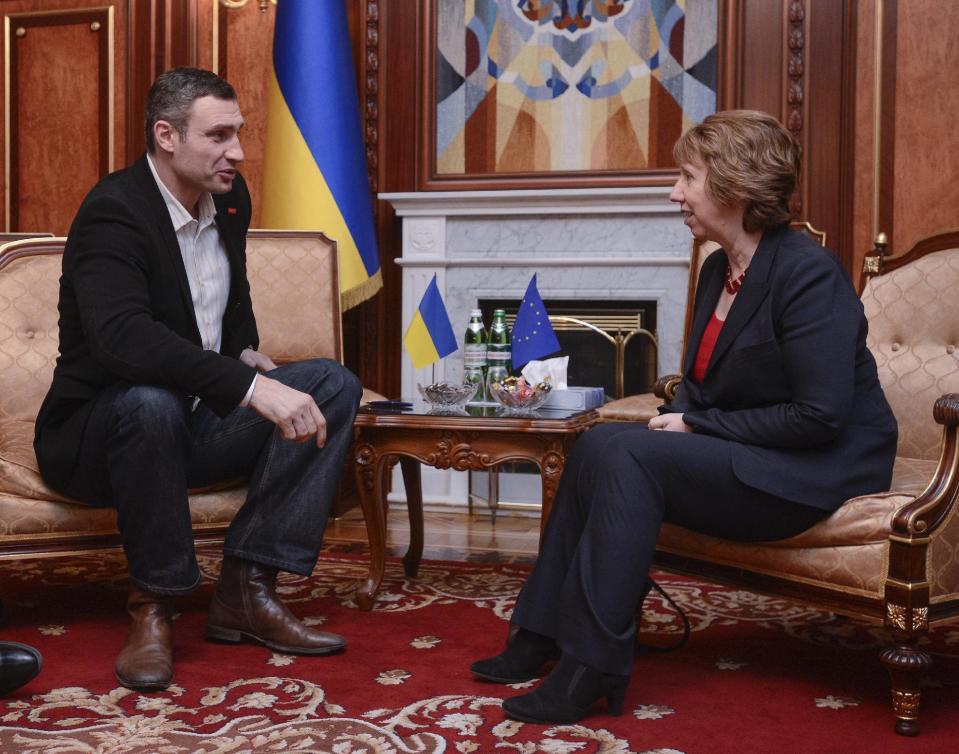 Ukrainian lawmaker and chairman of the Ukrainian opposition party Udar (Punch), former WBC heavyweight boxing champion Vitali Klitschko, left, speaks to EU foreign policy chief Catherine Ashton during their meeting in Kiev, Ukraine, Monday, Feb. 24, 2014.The head of OSCE, the European security organization is proposing the establishment of an international contact group to support Ukraine in its difficult transition period.(AP Photo/Andrew Kravchenko, pool)