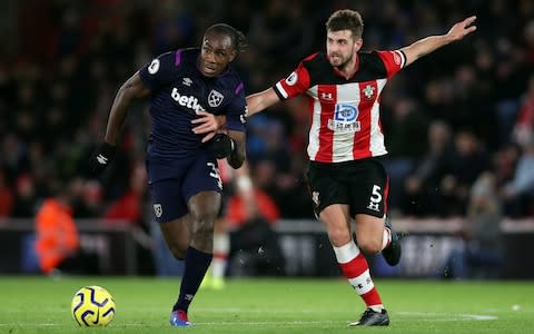 West Ham United's Michail Antonio in action with Southampton's Jack Stephens - Credit: Reuters