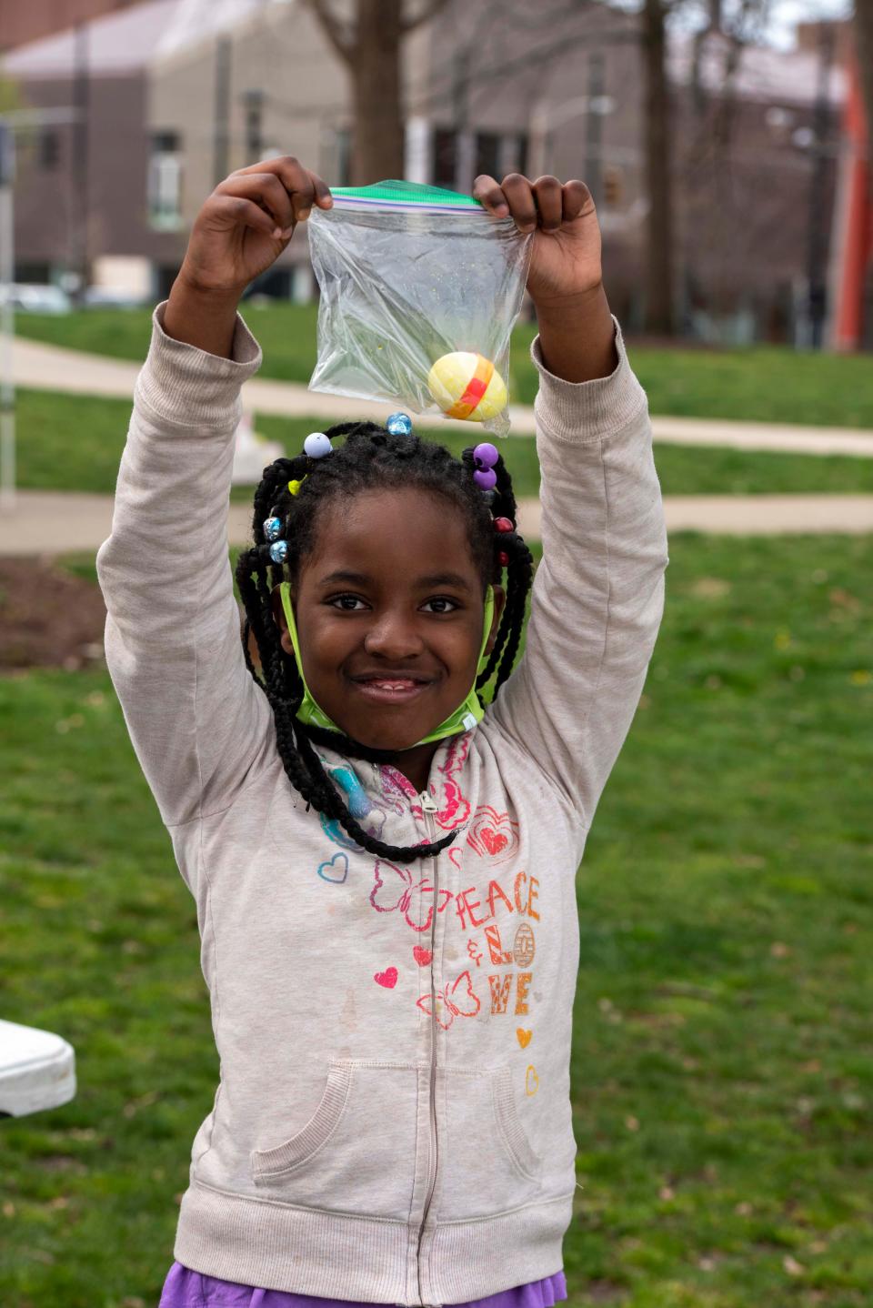 Shyah Watson proudly shows off her colored egg at a previous egg hunt in Washington Park.