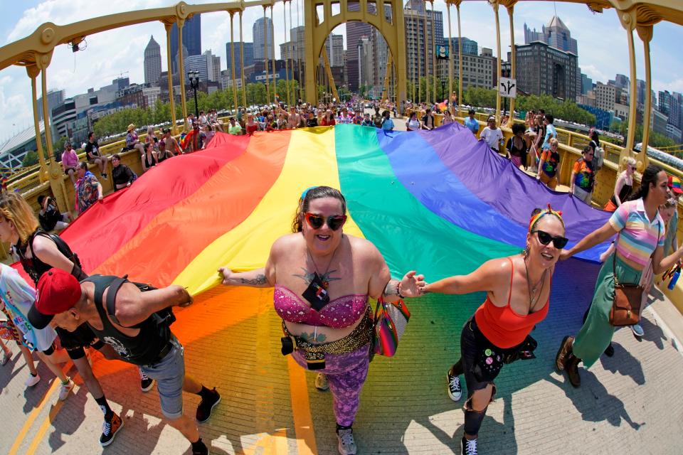 The Pittsburgh Pride parade, celebrating 50 years of Pittsburgh Pride, crosses the Andy Warhol bridge from downtown Pittsburgh, Saturday, June 3, 2023.