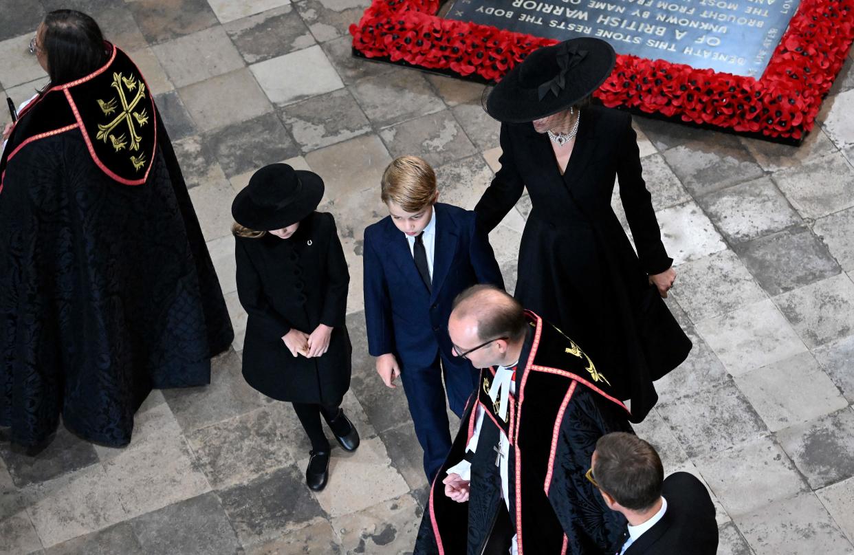 The Princess of Wales put at guiding hand on her son, Prince George's back after the family arrived at the Queen's funeral. (Getty Images)