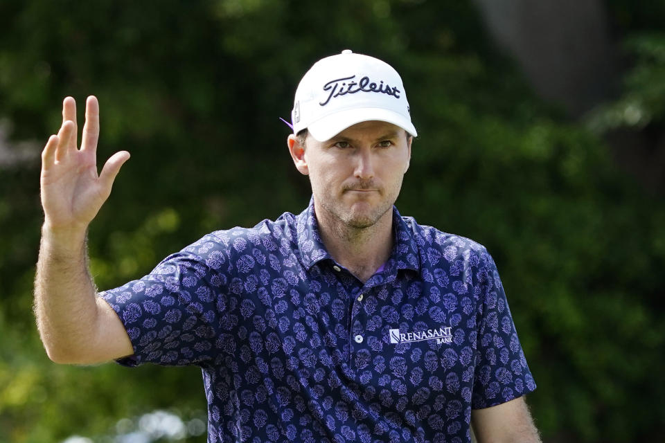 Russell Henley waves after making an eagle on the ninth hole during the second round of the Sony Open golf tournament, Friday, Jan. 14, 2022, at Waialae Country Club in Honolulu. (AP Photo/Matt York)