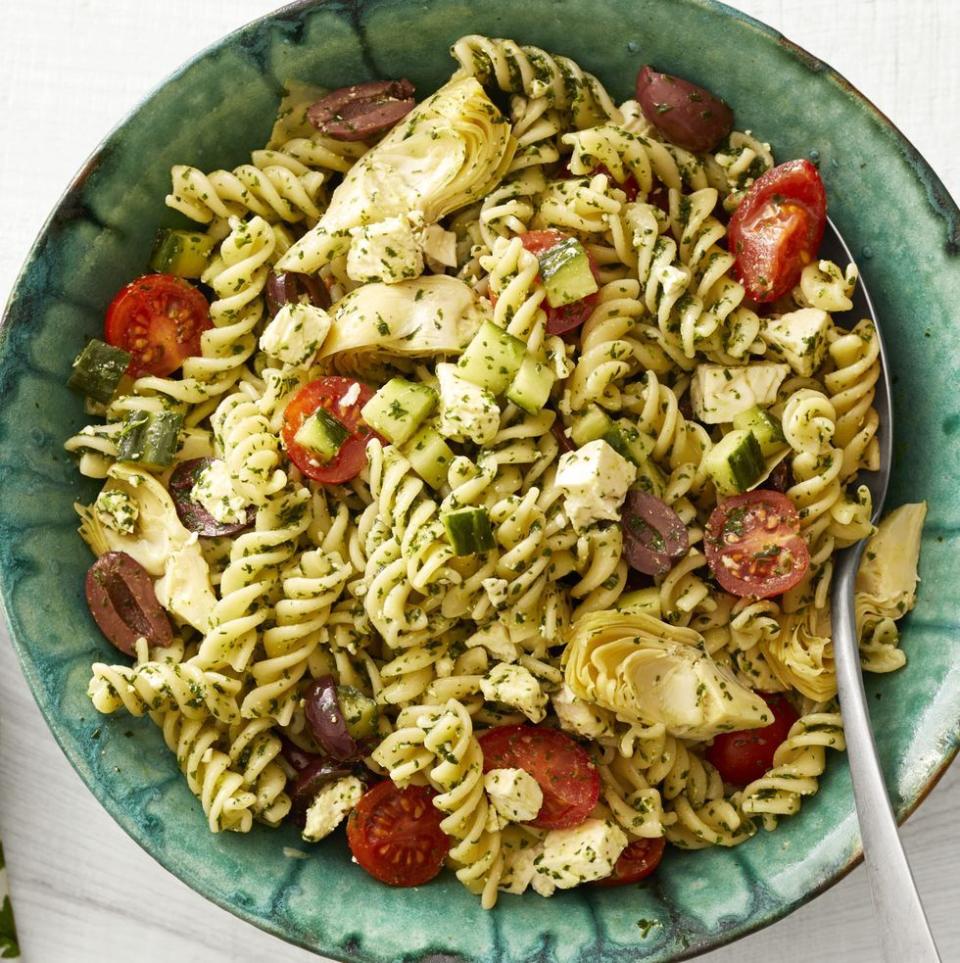 greek pesto pasta salad in turquoise bowl