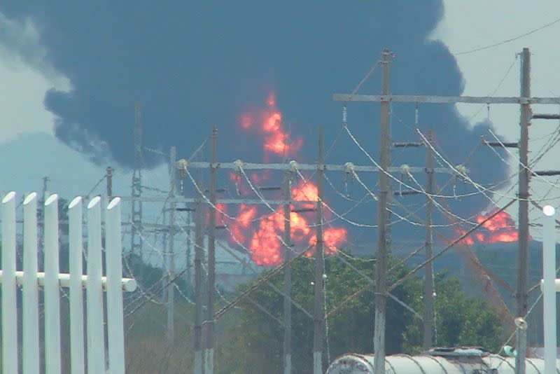A view shows a fire as Mexican state oil company Pemex fight to quell a fire in a gasoline storage tank at the Salina Cruz refinery, in Salina Cruz
