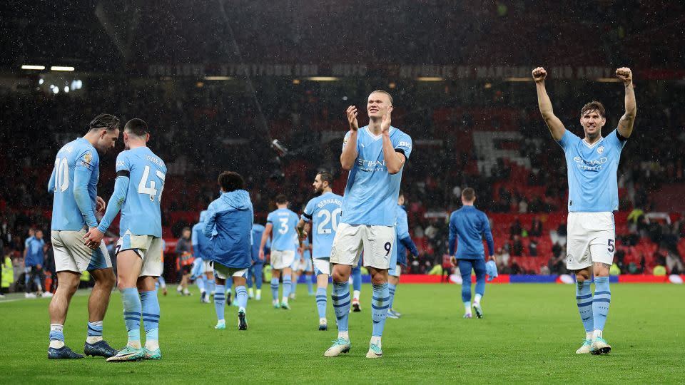 Erling Haaland and John Stones of Manchester City celebrate after humbling United 3-0 at Old Trafford on October 29. - Catherine Ivill/Getty Images